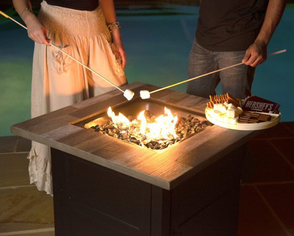roasting marshmallows over square fire pit